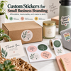 Custom stickers for small business branding displayed on packaging, a thank-you card, candle, water bottle, laptop, and sticker sheets.