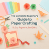 Paper crafting image with scissors and origami items.