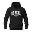Black inspirational hoodie featuring white Be Real Not Perfect lettering in a classic casual design