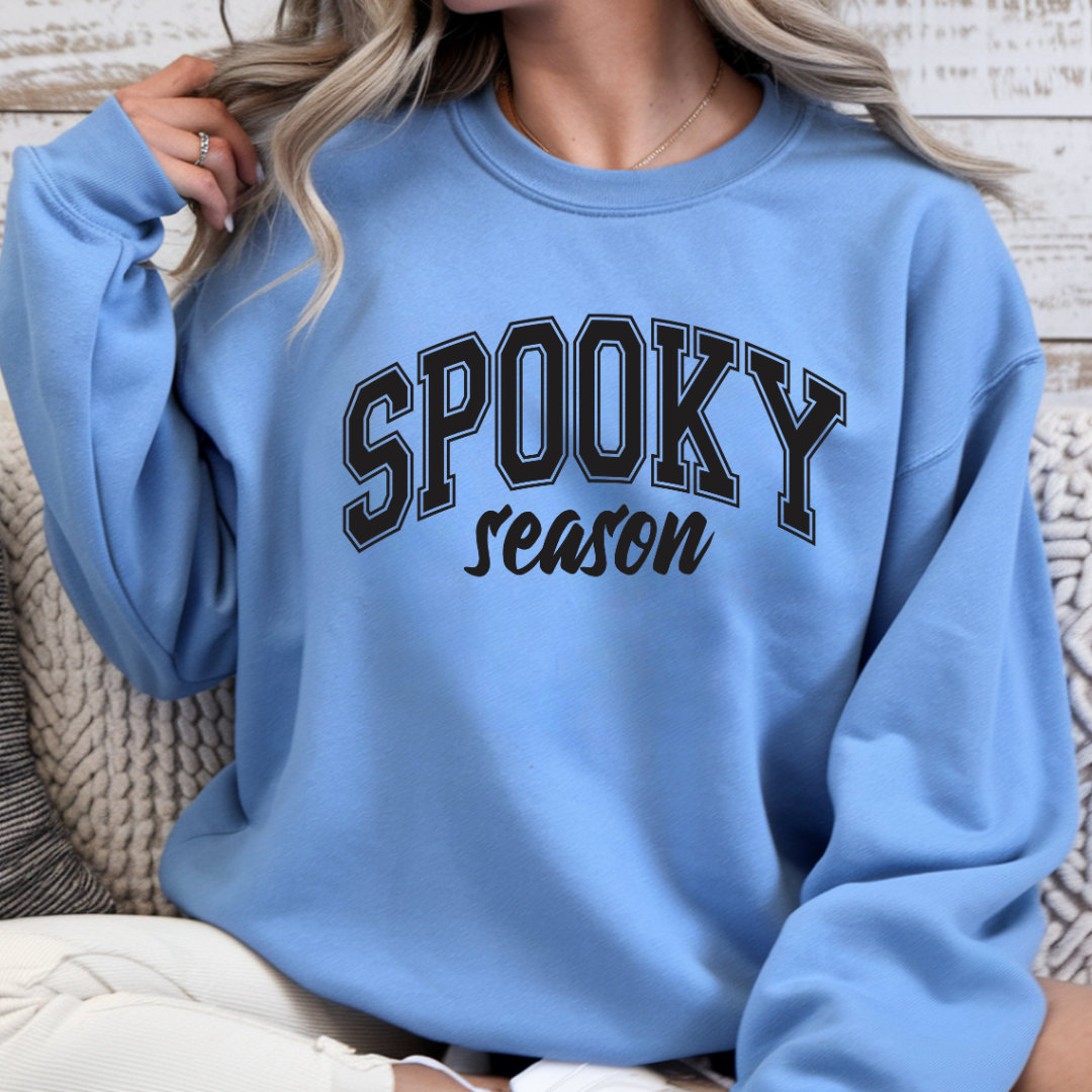 Carolina blue Spooky Season crewneck sweatshirt with black collegiate graphic for Halloween lovers and autumn wear
