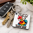 Funny chicken keychain hanging with car and house keys featuring a colourful rooster and sarcastic nasty look quote.