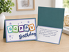 Colorful handmade Happy Birthday greeting card featuring layered cardstock letters, elegant die cut script, premium paper, and heartfelt birthday message.