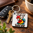Sarcastic rooster keychain displayed beside car keys with the funny saying I would give you a nasty look but I see you already have one.