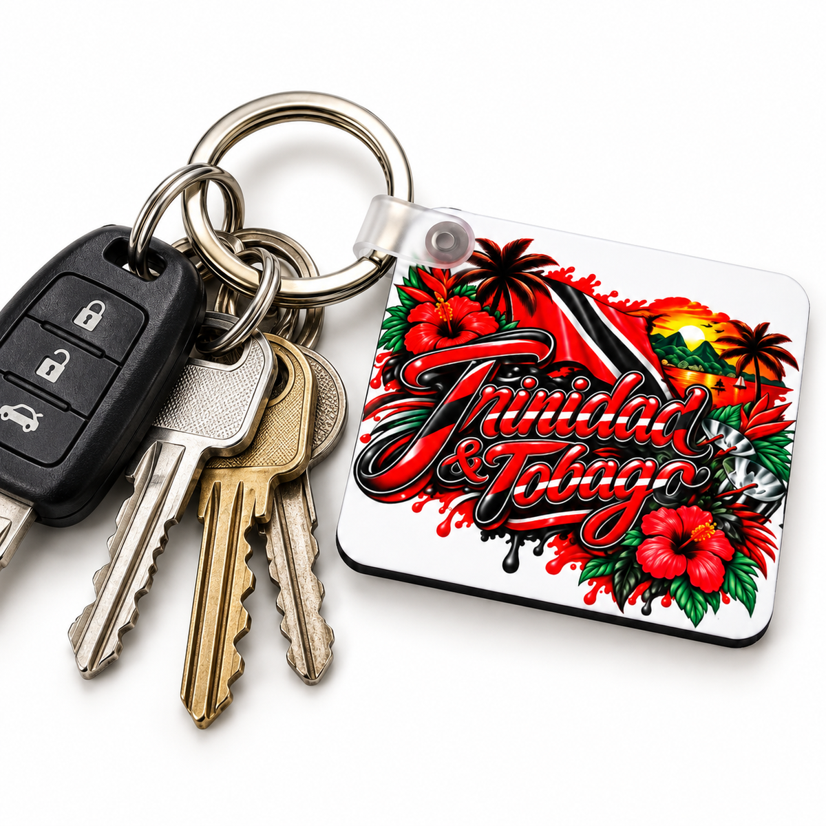 Trinidad and Tobago keychain attached to house and car keys featuring red black and white flag colours, hibiscus flowers and tropical island artwork.