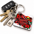 Trinidad and Tobago Caribbean pride keychain with bold tropical hibiscus flowers, palm trees, sunset scenery and national flag inspired design.