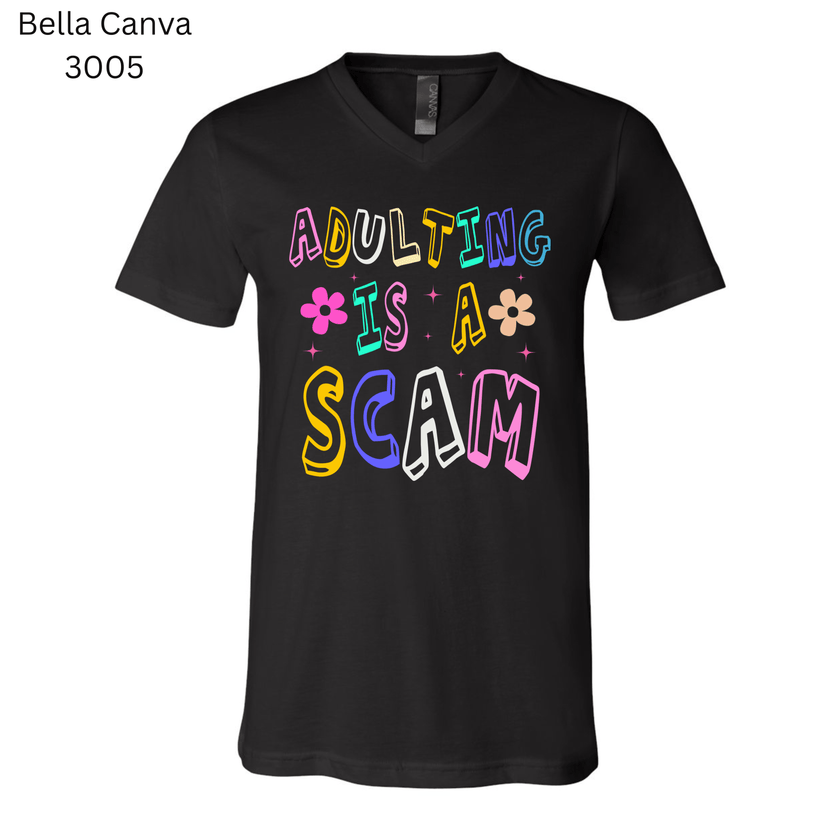 Adulting Is a Scam’ funny T-shirt. Trendy unisex shirt that makes a great novelty gift for millennials and Gen Z