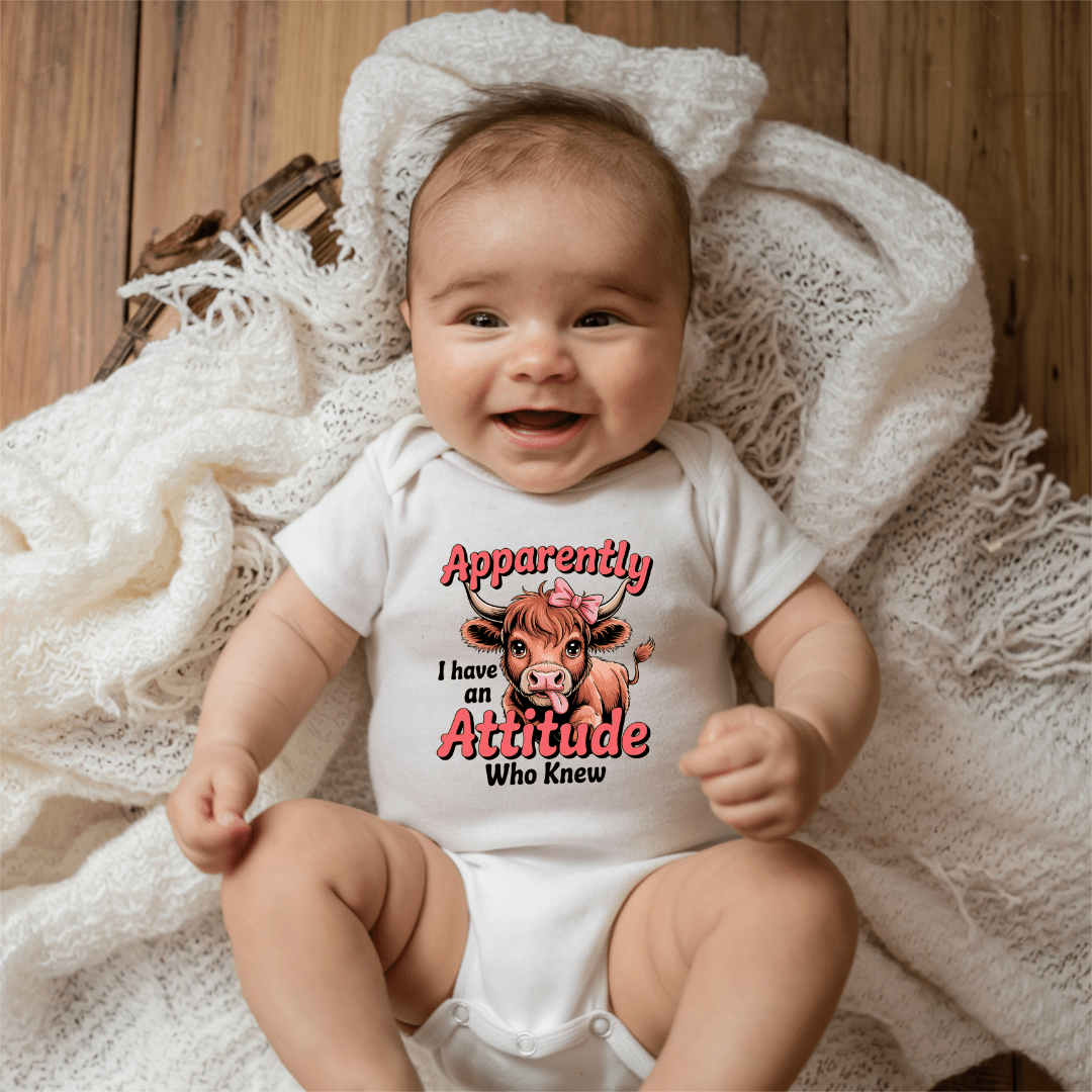 baby smiling wearing cute funny onesie with cow illustration