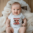baby wearing funny onesie with apparently i have an attitude text design