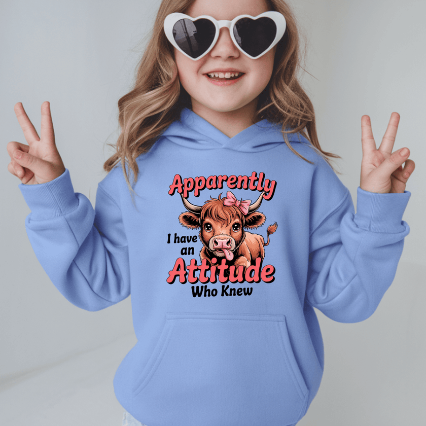 Carolina blue kids hoodie with funny cow illustration and playful attitude slogan for girls
