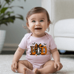 Baby Halloween onesie with adorable ghost, pumpkins, bats, candy corn and oversized orange and black bow design