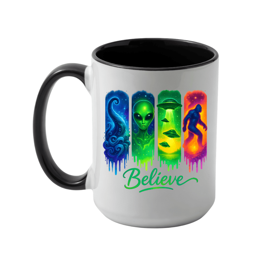 Black accent Believe alien coffee mug with colourful UFO Bigfoot and paranormal graphic on a glossy white ceramic body.