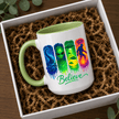 Green accent Believe alien UFO Bigfoot mug displayed in a gift box, perfect for cryptid and paranormal enthusiasts.