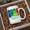 Large white Believe alien UFO Bigfoot coffee mug featuring bright extraterrestrial artwork and colourful cosmic imagery.