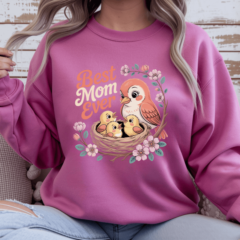 Heloncia pink crewneck with cheerful floral bird design.
