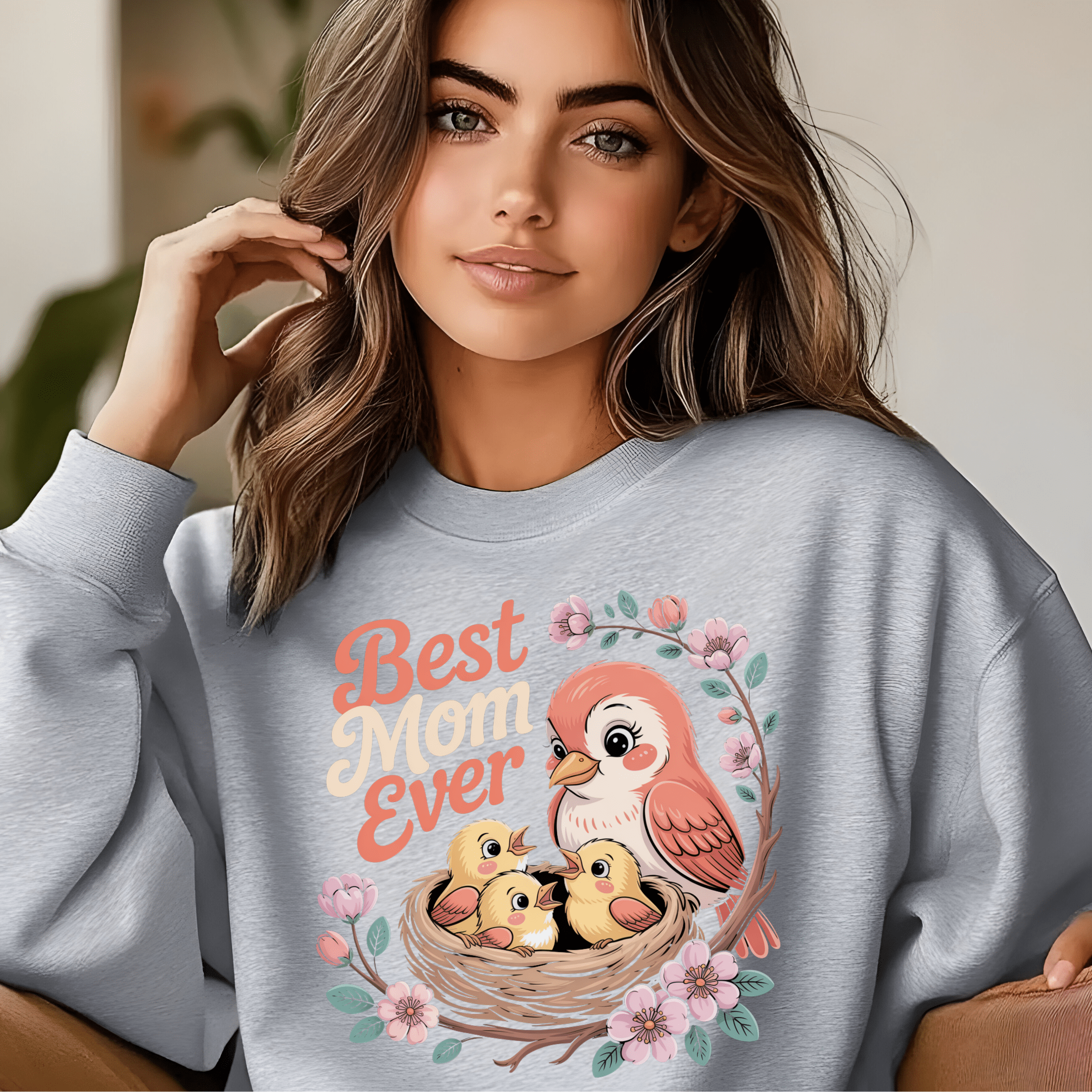 Heather gray crewneck featuring soft pastel bird family illustration.