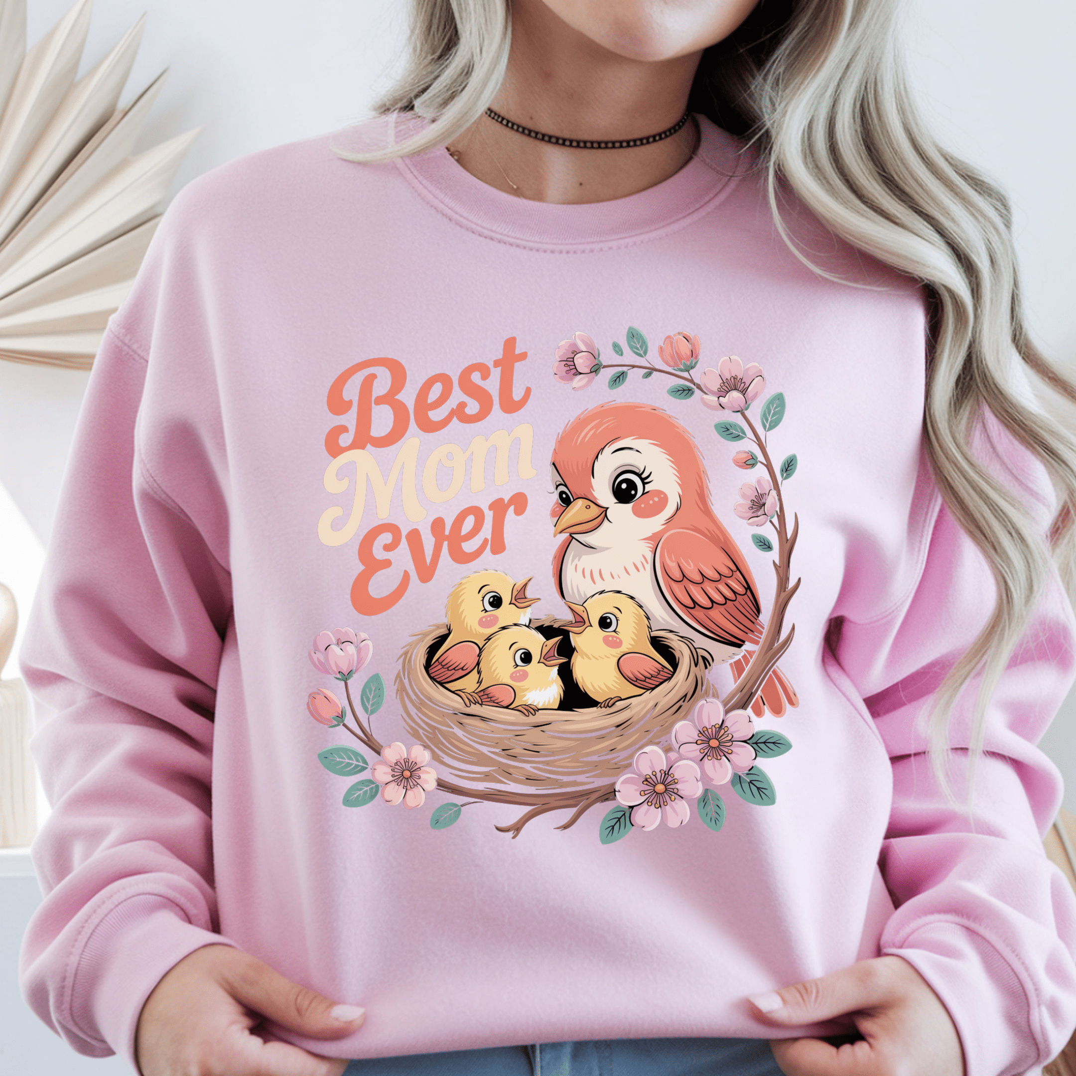 Light pink crewneck with vibrant Best Mom Ever design and illustrated bird family.