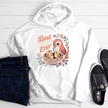 White hoodie with warm-toned Best Mom Ever artwork and decorative flowers.