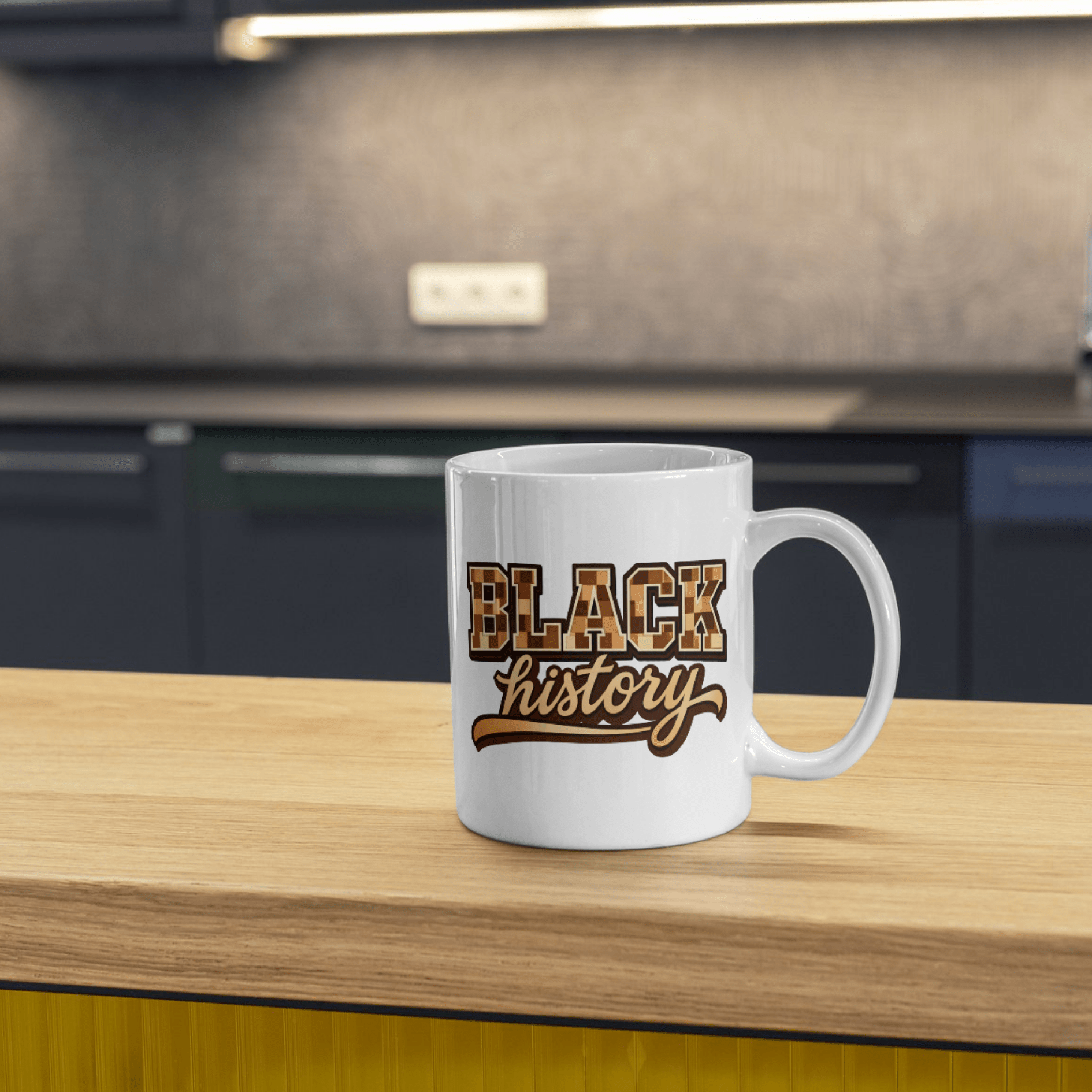 White Black History mug with bold lettering sitting on wood kitchen counter with blurred background.