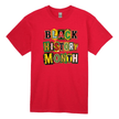 Red t-shirt with 'Black History Month' text in colorful letters on a white background