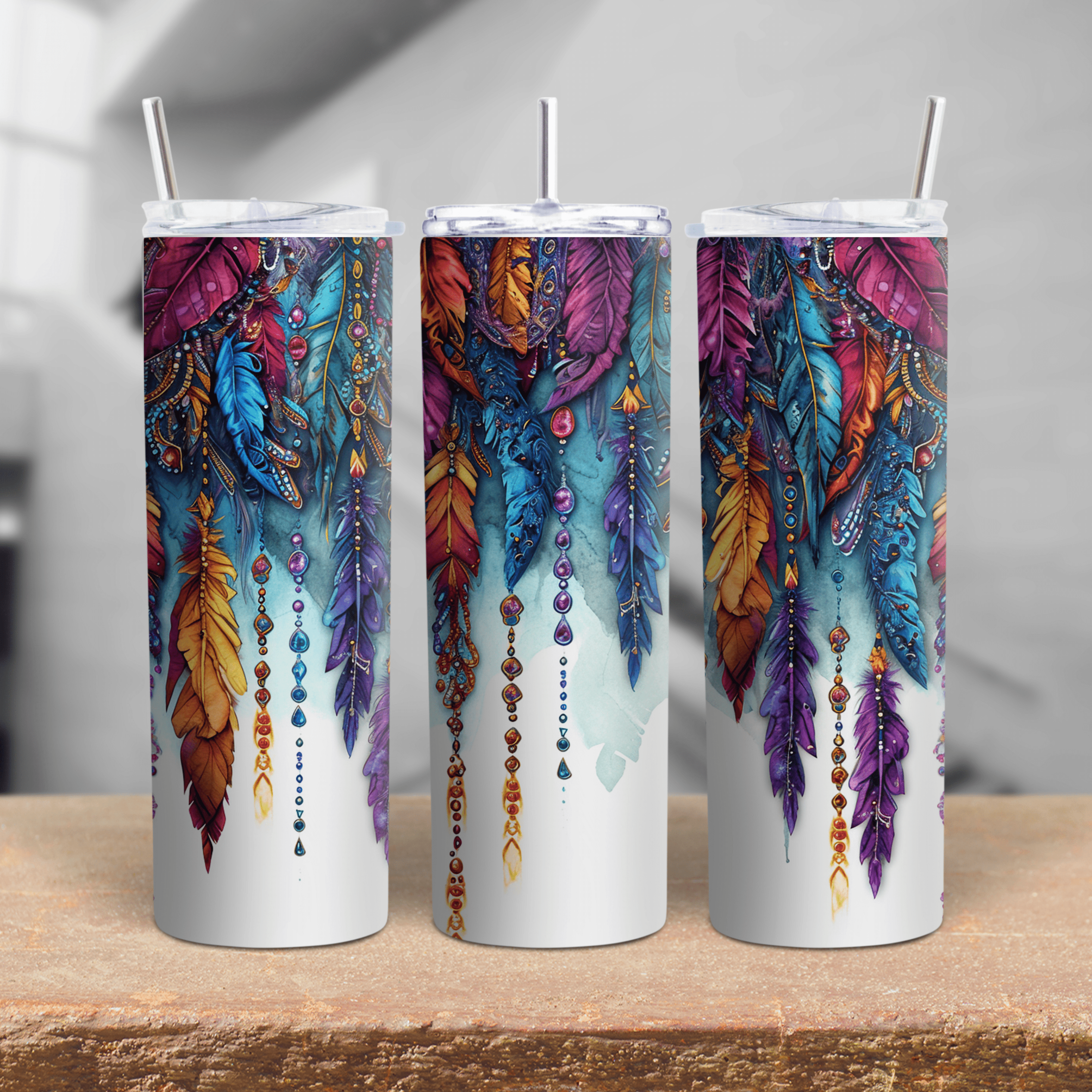 20oz stainless steel insulated tumbler with detailed bohemian feather artwork and gemstone-style accents.