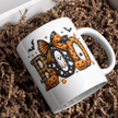 Cute spooky season coffee mug featuring BOO artwork on a classic white ceramic mug for fall home decor