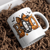 Cute spooky season coffee mug featuring BOO artwork on a classic white ceramic mug for fall home decor