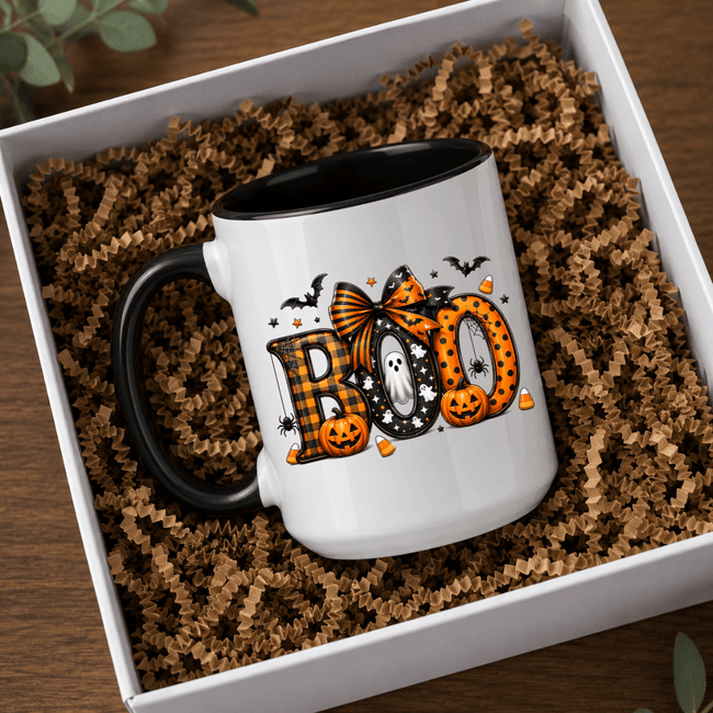 Black accent Halloween mug with bold BOO artwork and seasonal fall graphics presented in a premium boxed mockup