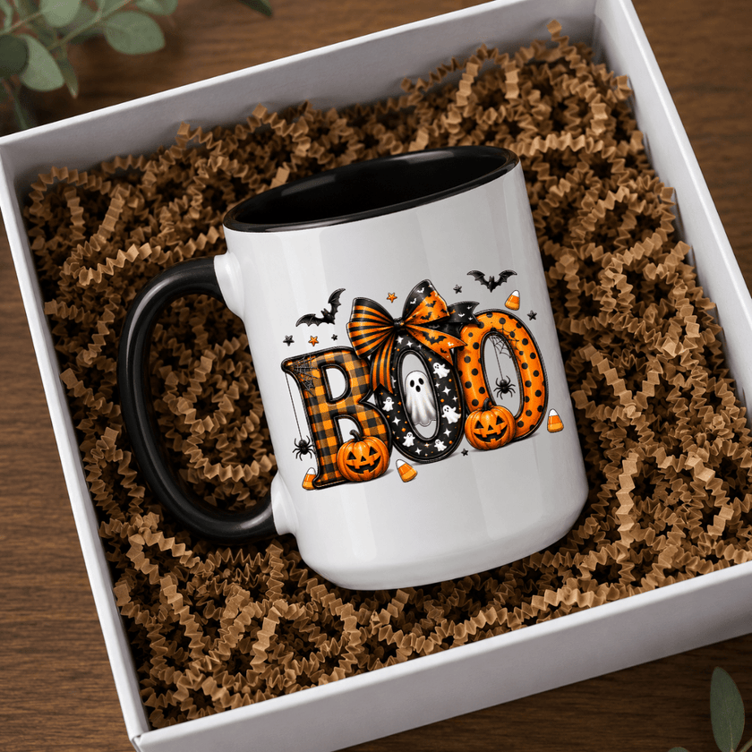Black accent Halloween mug with bold BOO artwork and seasonal fall graphics presented in a premium boxed mockup