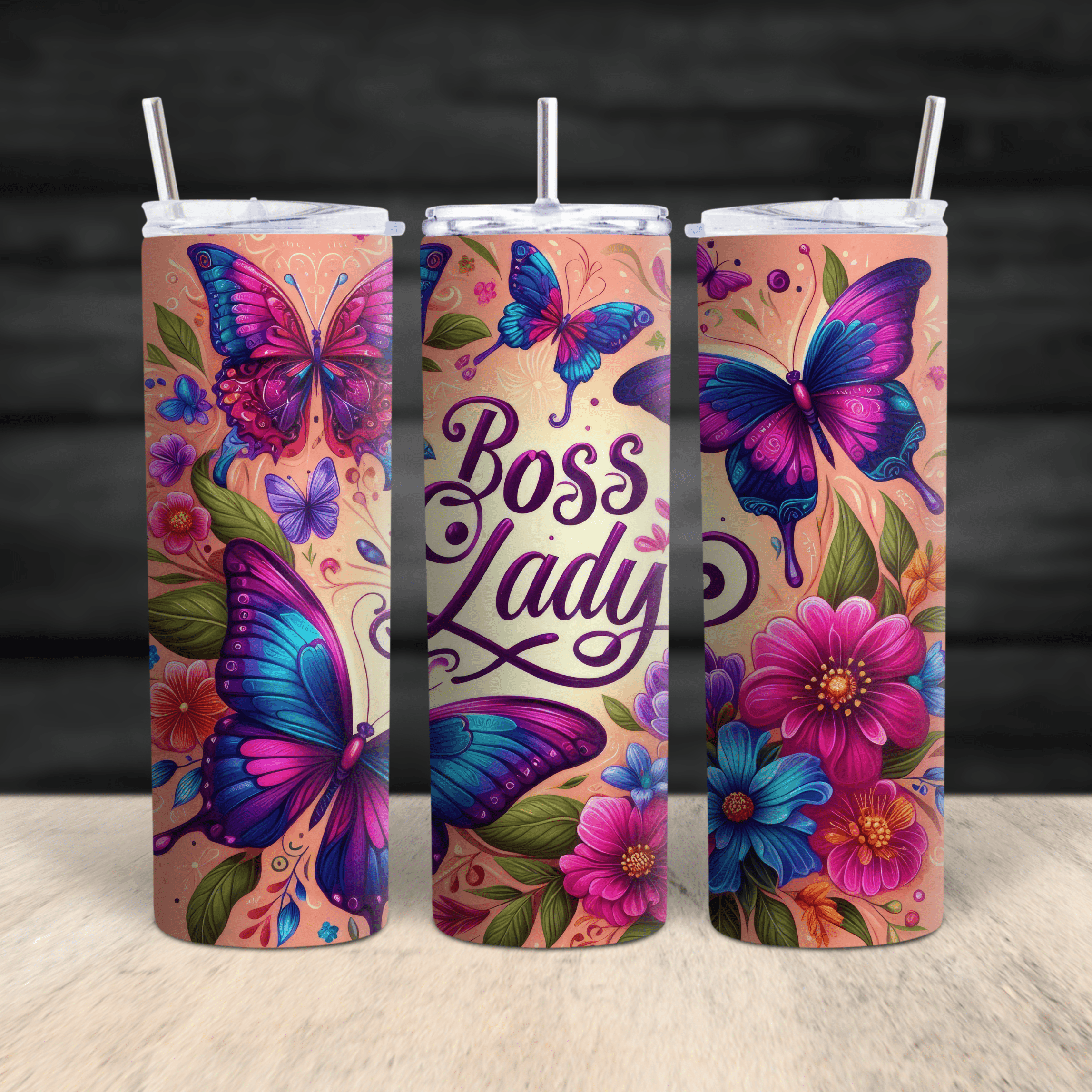 Floral and butterfly stainless steel tumbler featuring Boss Lady text in 360-degree wrap.