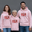 Light pink Canada Day matching family hoodies with colorful patriotic Canadian design