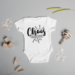 Front view of white onesie showing Chaos Creator text with burst and stars