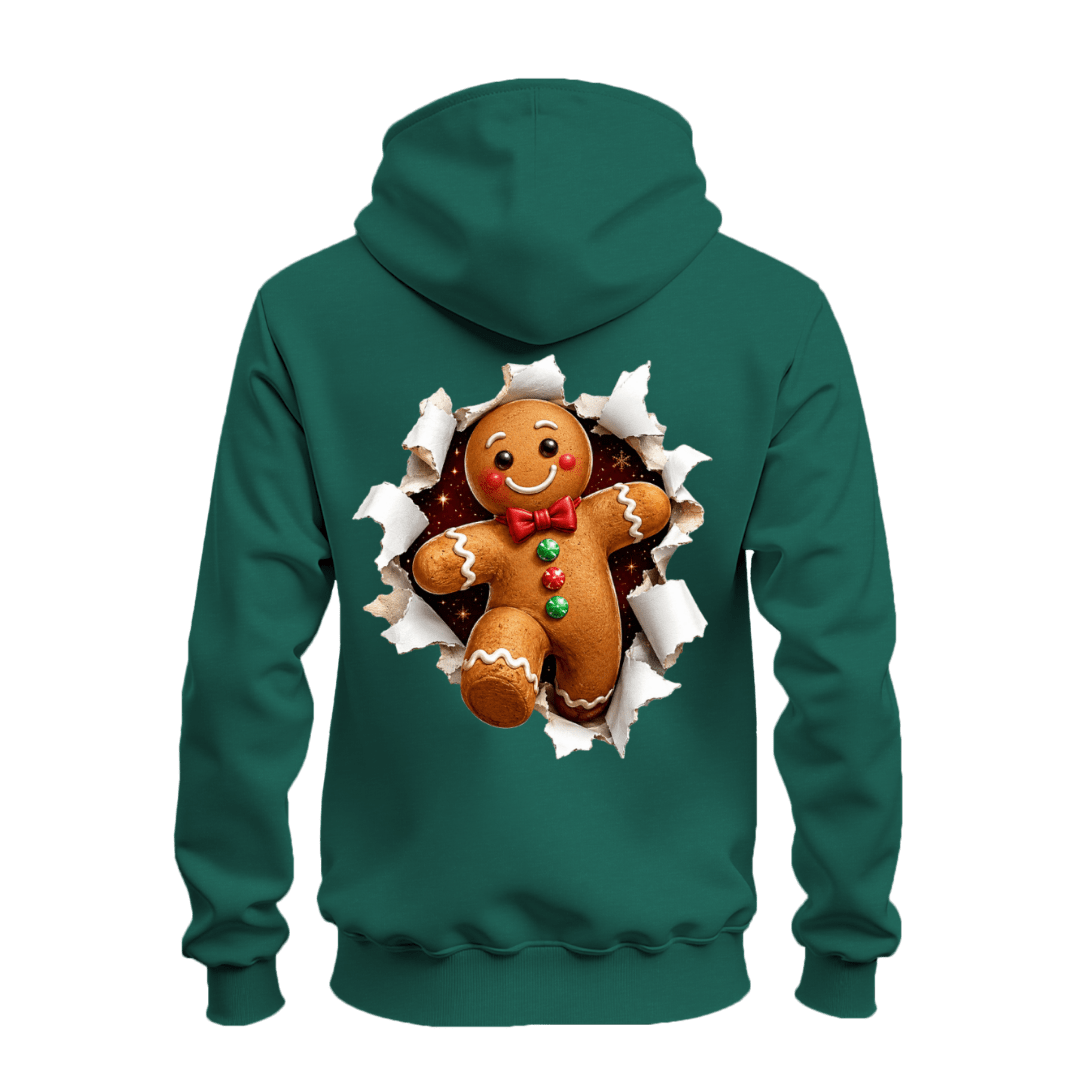Forest green holiday hoodie featuring an oversized gingerbread man bursting through torn paper on the back.