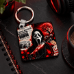 Cinema themed Halloween keychain hanging with keys, featuring dramatic red moon, masked horror character and slasher artwork.