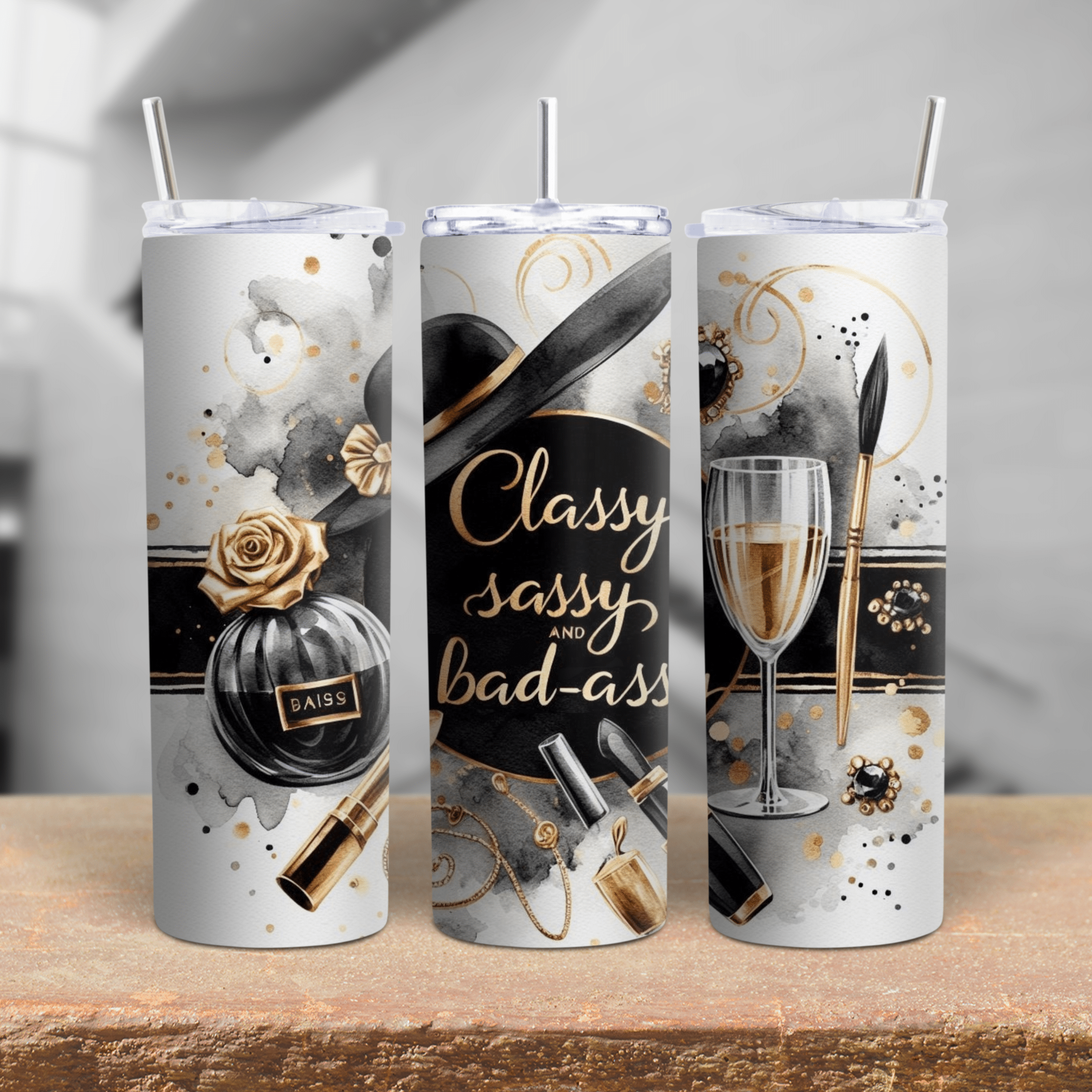 A chic black, white, and gold tumbler with perfume bottle, champagne glass, makeup items, and elegant script.