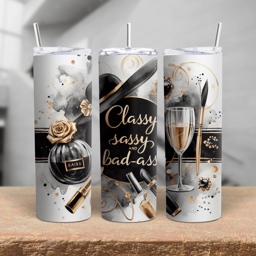 A chic black, white, and gold tumbler with perfume bottle, champagne glass, makeup items, and elegant script.