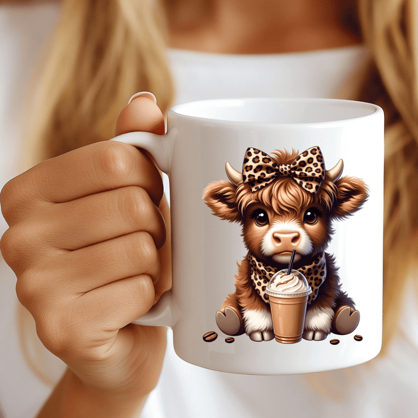 cute highland cow coffee mug with bow holding iced coffee drink aesthetic design