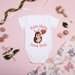 Close up of love bug print on soft cotton baby onesie