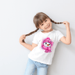 Cute winter cartoon snowman printed on a children’s t-shirt with colorful splatter background.