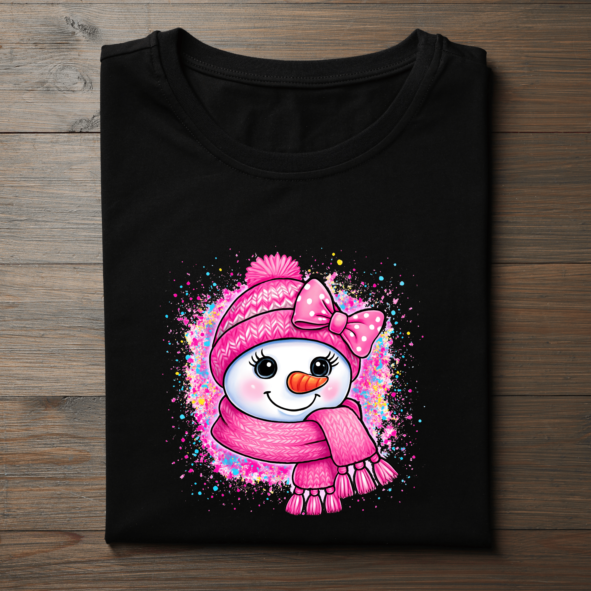 Festive Christmas t-shirt with cute snowman character wearing a pink hat and scarf.