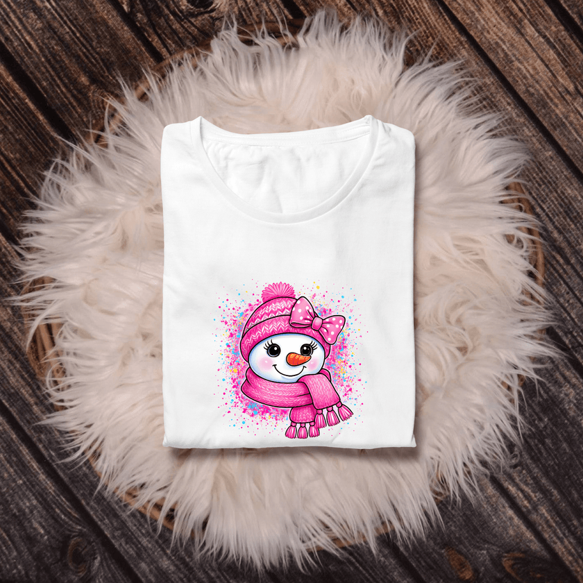 Kawaii-style snowman tee in bright pink colors with playful winter artwork.