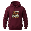 Maroon Sasquatch hoodie featuring Don’t Be An Assquatch text, forest artwork, and a cozy casual pullover style.