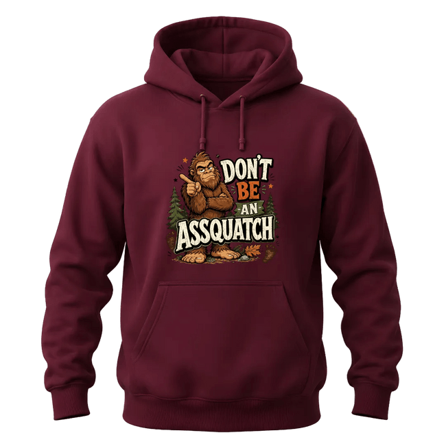 Maroon Sasquatch hoodie featuring Don’t Be An Assquatch text, forest artwork, and a cozy casual pullover style.
