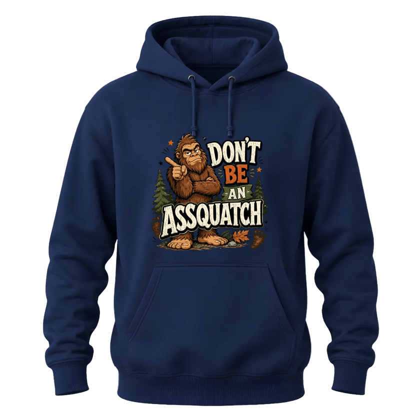 Navy hoodie with Don’t Be An Assquatch text, humorous Bigfoot character, pine trees, and bold outdoor style.