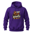 Purple graphic hoodie featuring a humorous Sasquatch design with pine trees, footprints, and Don’t Be An Assquatch lettering.
