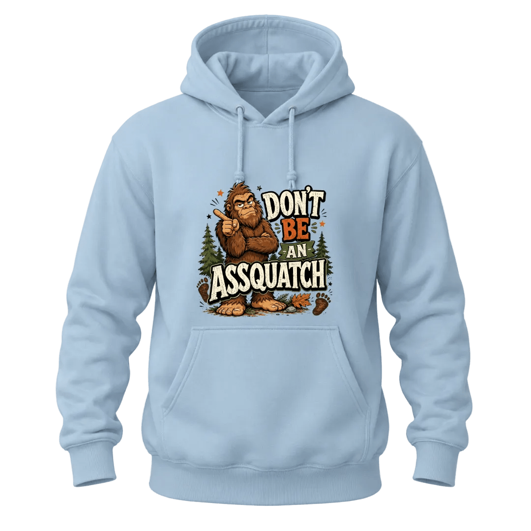 Light Blue hoodie with a bold Don’t Be An Assquatch Sasquatch design, woodland graphics, and playful Bigfoot quote.