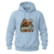 Light Blue hoodie with a bold Don’t Be An Assquatch Sasquatch design, woodland graphics, and playful Bigfoot quote.