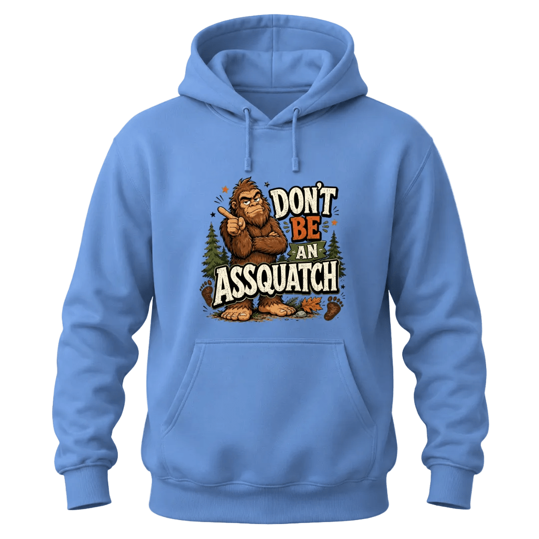 Carolina Blue hoodie with funny Bigfoot design, Don’t Be An Assquatch text, forest trees, and casual cozy style.