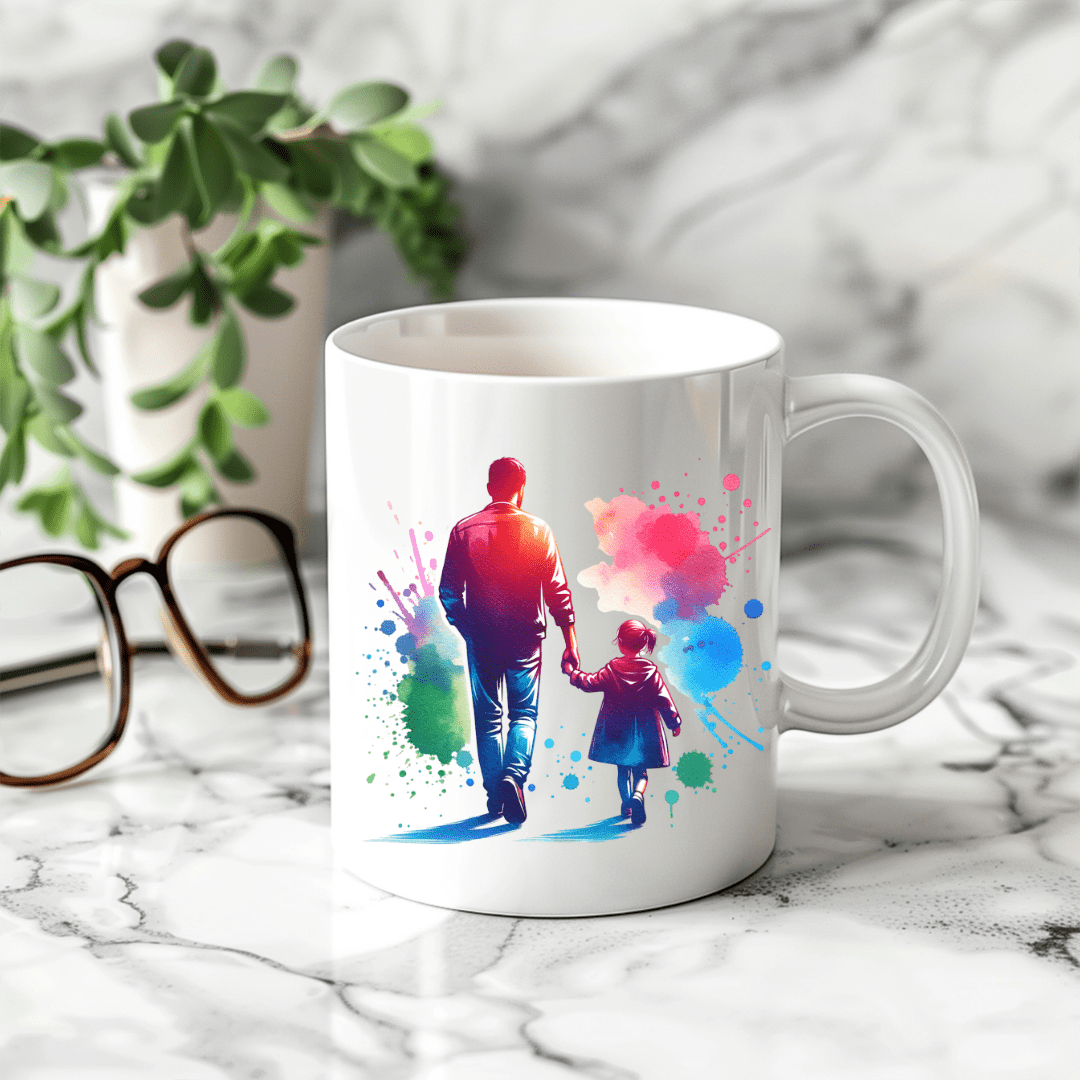 Artistic father and daughter coffee cup with bright watercolor paint design displayed on marble countertop