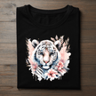 Black t-shirt featuring a floral white tiger graphic design with pastel flowers