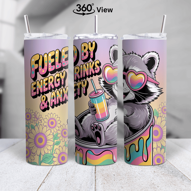 Funny raccoon tumbler with pastel colors, sunflowers, and the phrase ‘Fueled by Energy Drinks & Anxiety’ in a 360-degree wrap design.
